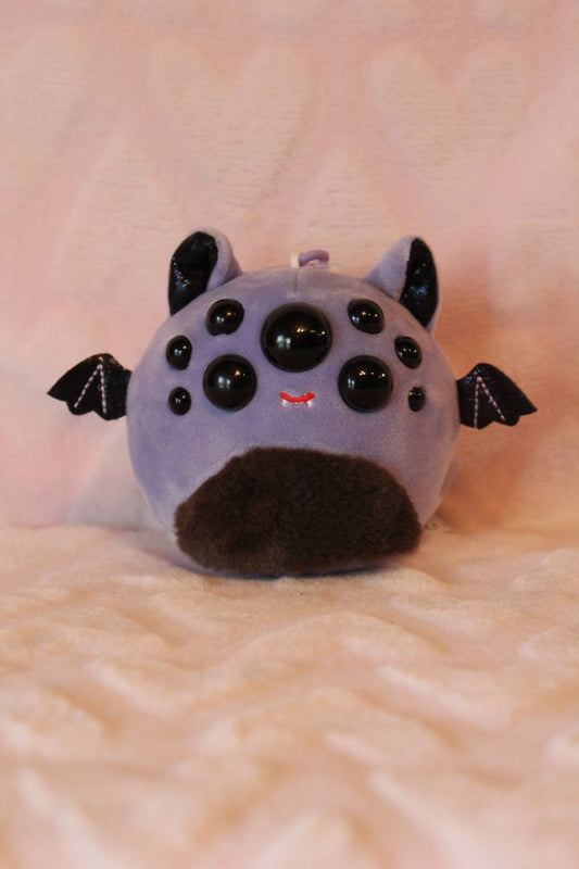 Purple bat clip on squishmallow 1