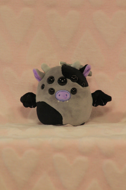Clip on cow bat squish 1